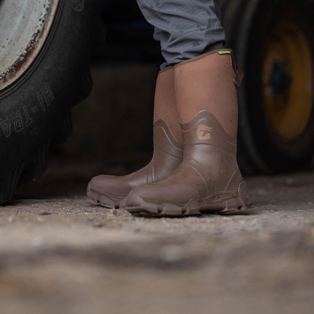 Pair of Gator Waders Omega Flow Boots n someones feet.