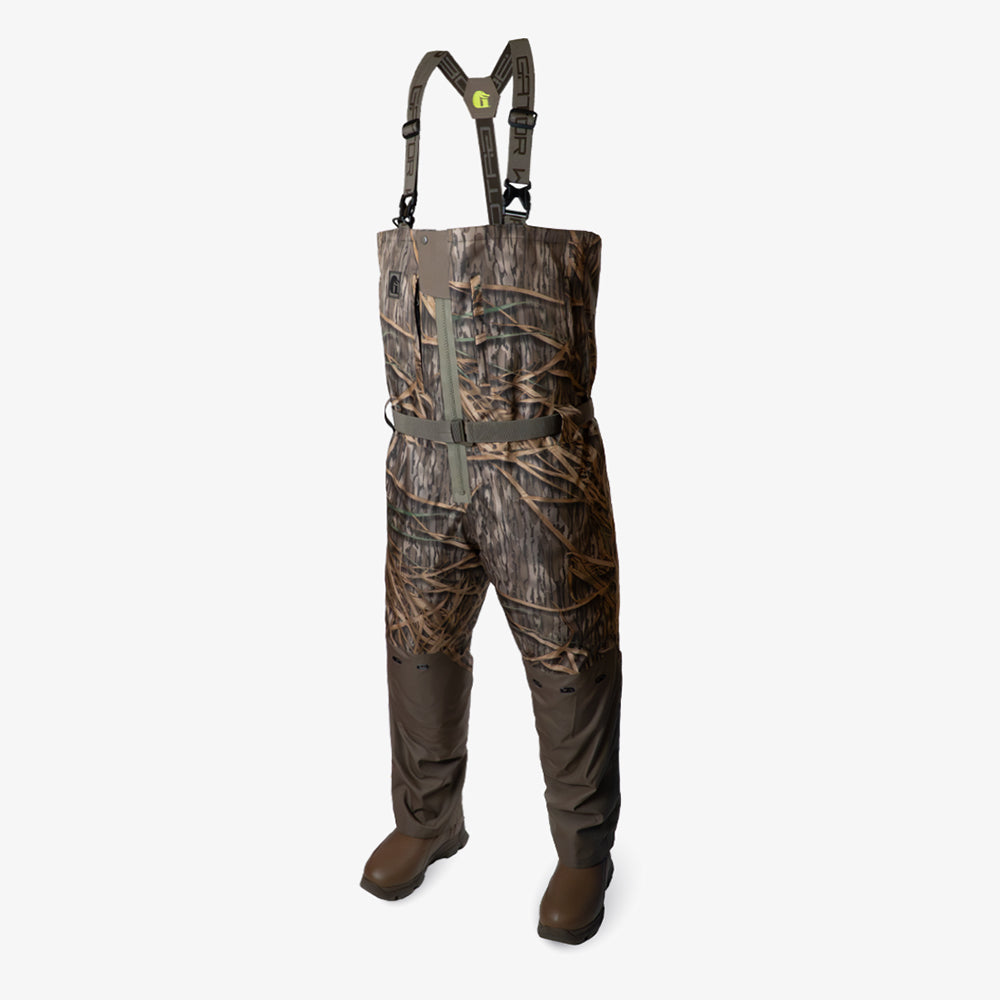 Mossy Oak Original Shadow Grassing camo hunting waders with suspenders on a white background