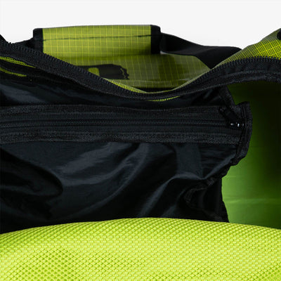 migrator duffle bag lime - inside pocket view